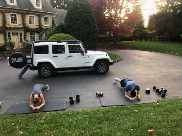 True Grit Fitness, On Site personal training, image of two people exercising outside, plank exercise
